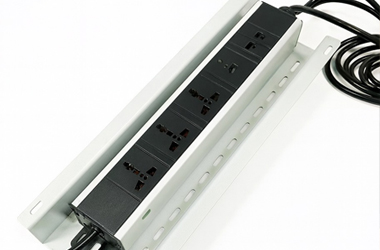 Power distribution unit mounted under a desk